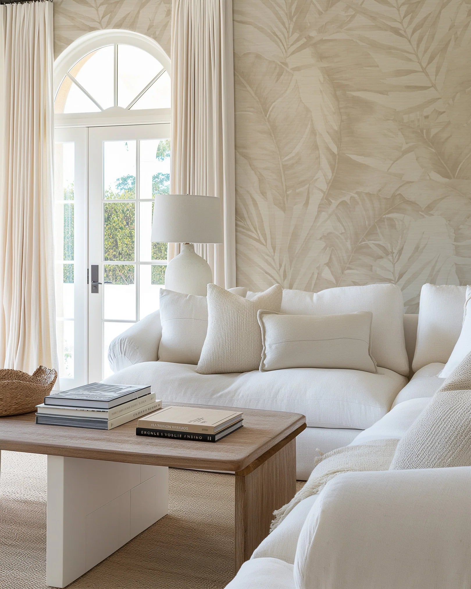 Bright living room with refined coastal wallpaper